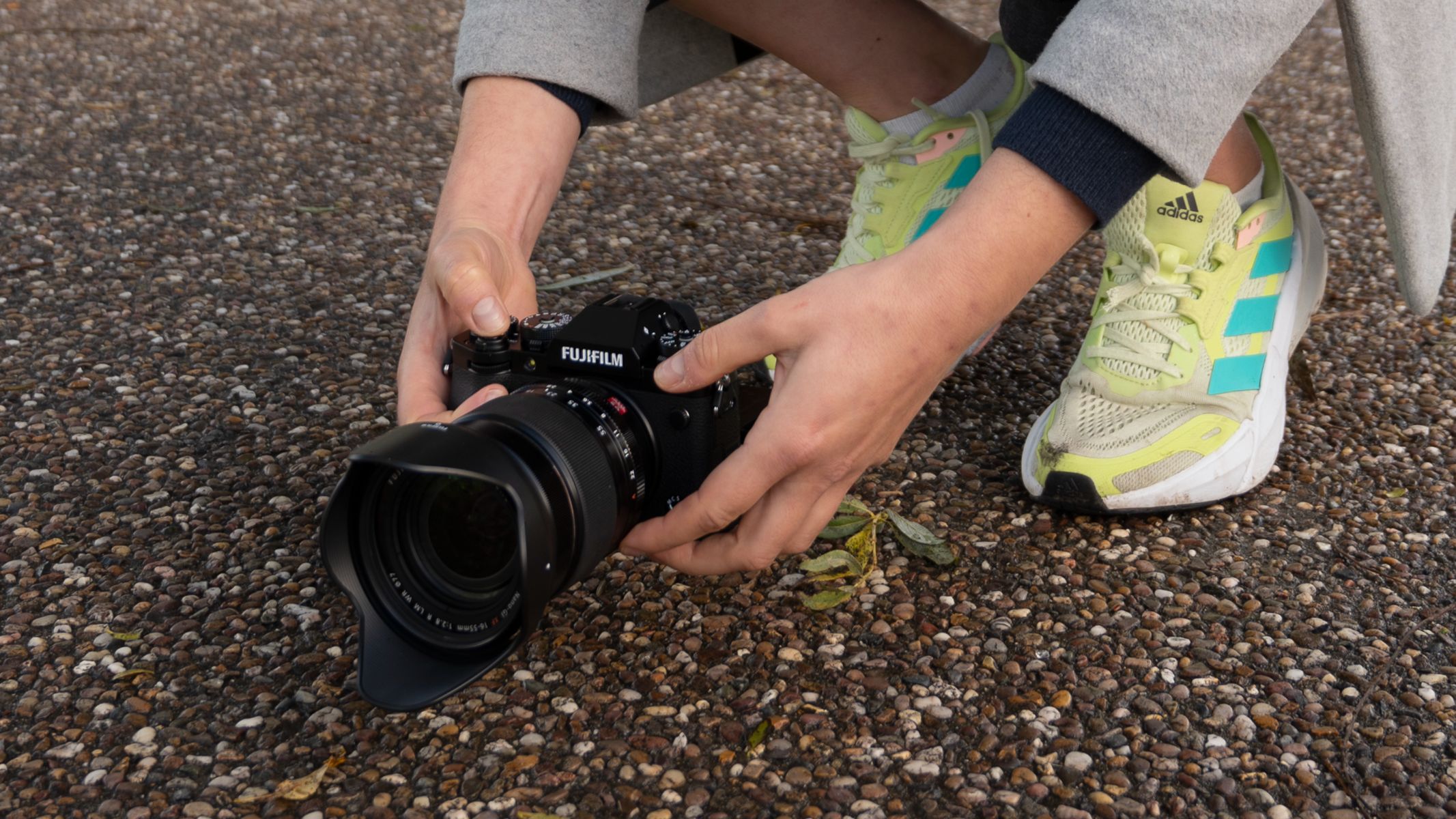 Fujifilm X-T5 in-hand shooting at a low angle with the rear screen