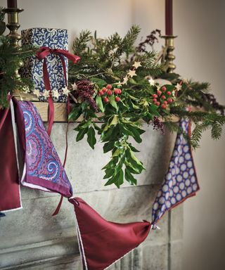 Foliage and berries arranged on the mantel