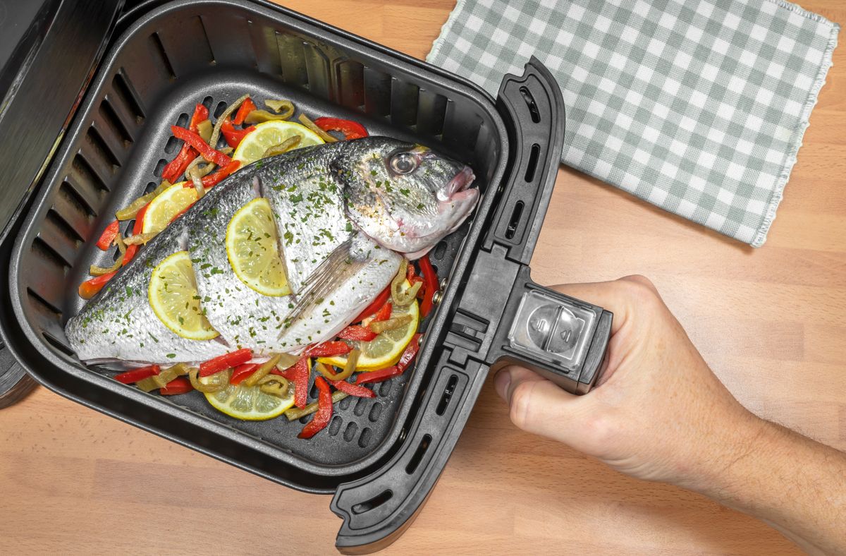 Whole fish being cooked in an air fryer