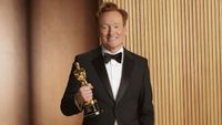 Conan O'Brien poses alongside an Oscar statuette for the 98th Academy Awards.