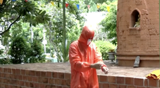 A monk in Thailand wearing PPE made from plastic bottles.