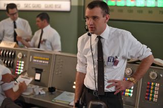 Mercury astronaut Deke Slayton, portrayed by Micah Stock, serves as capcom in the Mercury Control Center, in the first season finale of National Geographic's "The Right Stuff."