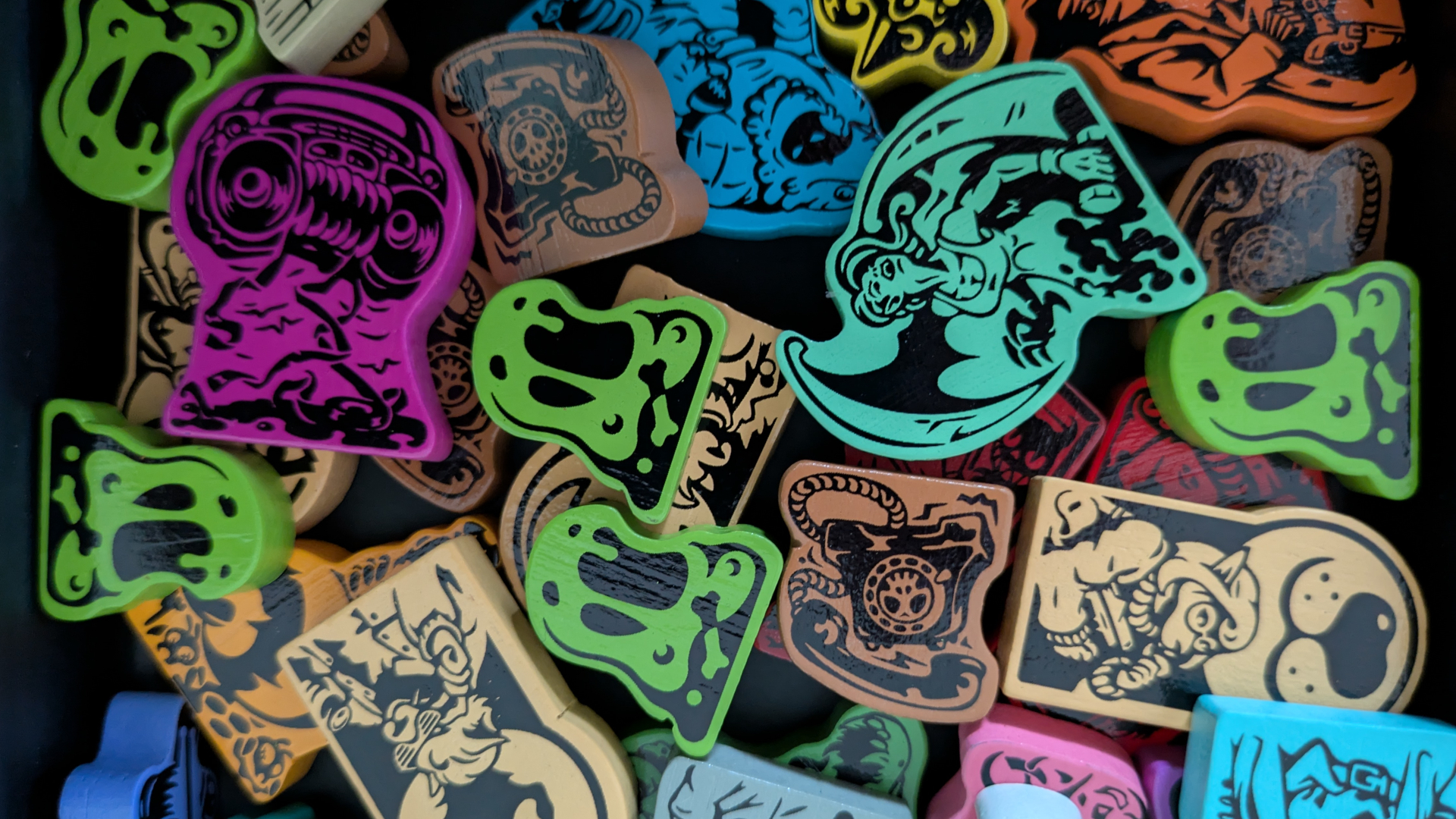 Spooktacular tokens piled on top of each other, on a dark background