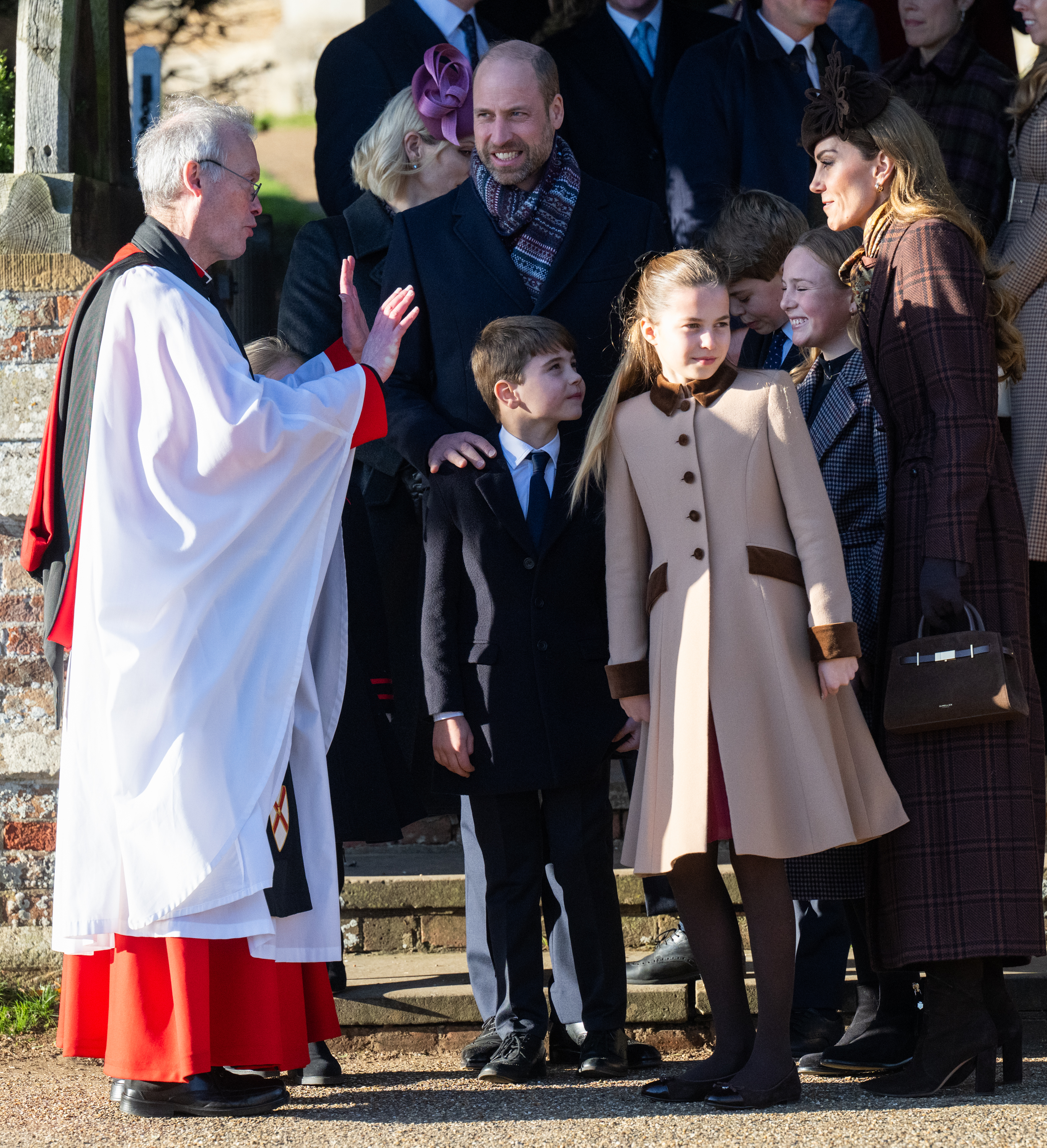 Princess Charlotte, Prince Louis standing with Prince William and Princess Kate outside church