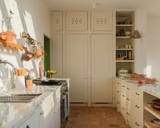 Cream kitchen with floor-to-ceiling kitchen storage