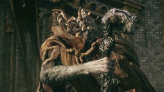 Elden Ring Margit the Fell Omen boss standing on fort battlements with staff in front of chest