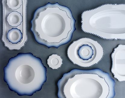 A range of crockery in white with blue edging