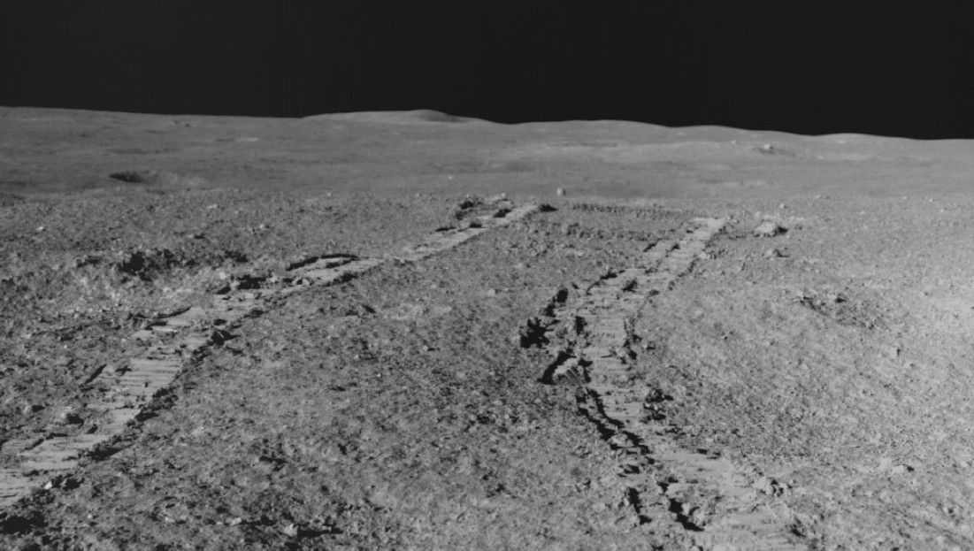 Tracks from India&#039;s lunar rover appear on the grey, dusty surface of the moon&#039;s south pole