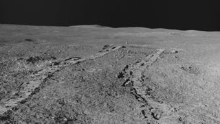 Tracks from India&#039;s lunar rover appear on the grey, dusty surface of the moon&#039;s south pole