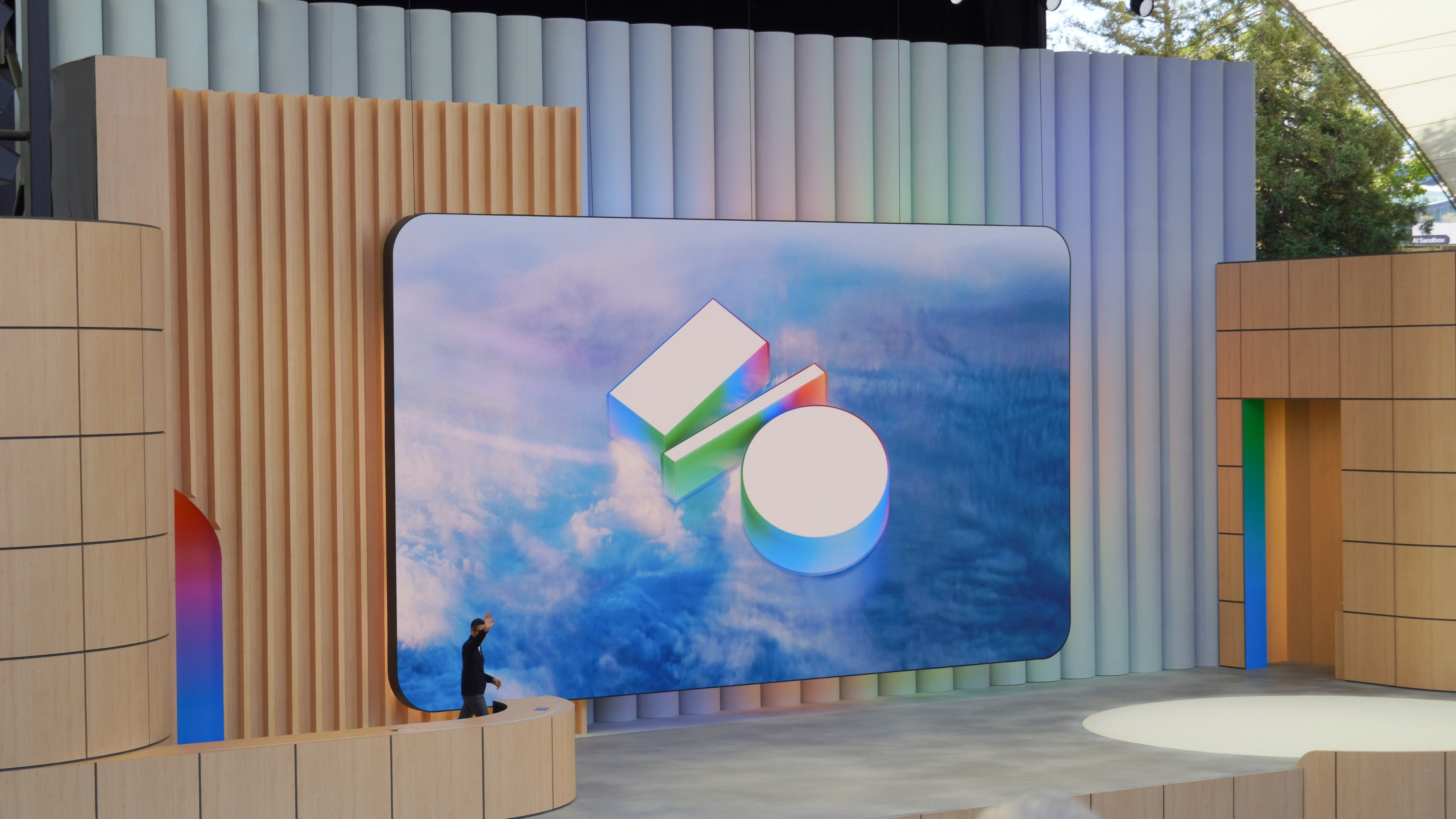 The Google I/O 2025 logo on the main event stage with Sundar Pichai walking on.