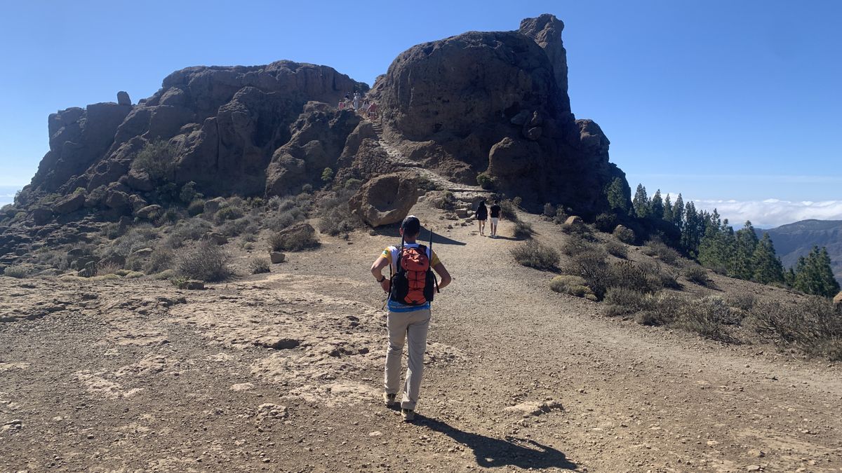 Hiker looking at Roque Nublo