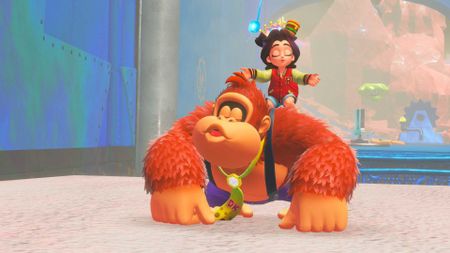 Donkey Kong Bananza screenshot showing Pauline on DK's shoulder as they both whistle a tune and Pauline wears a small crown
