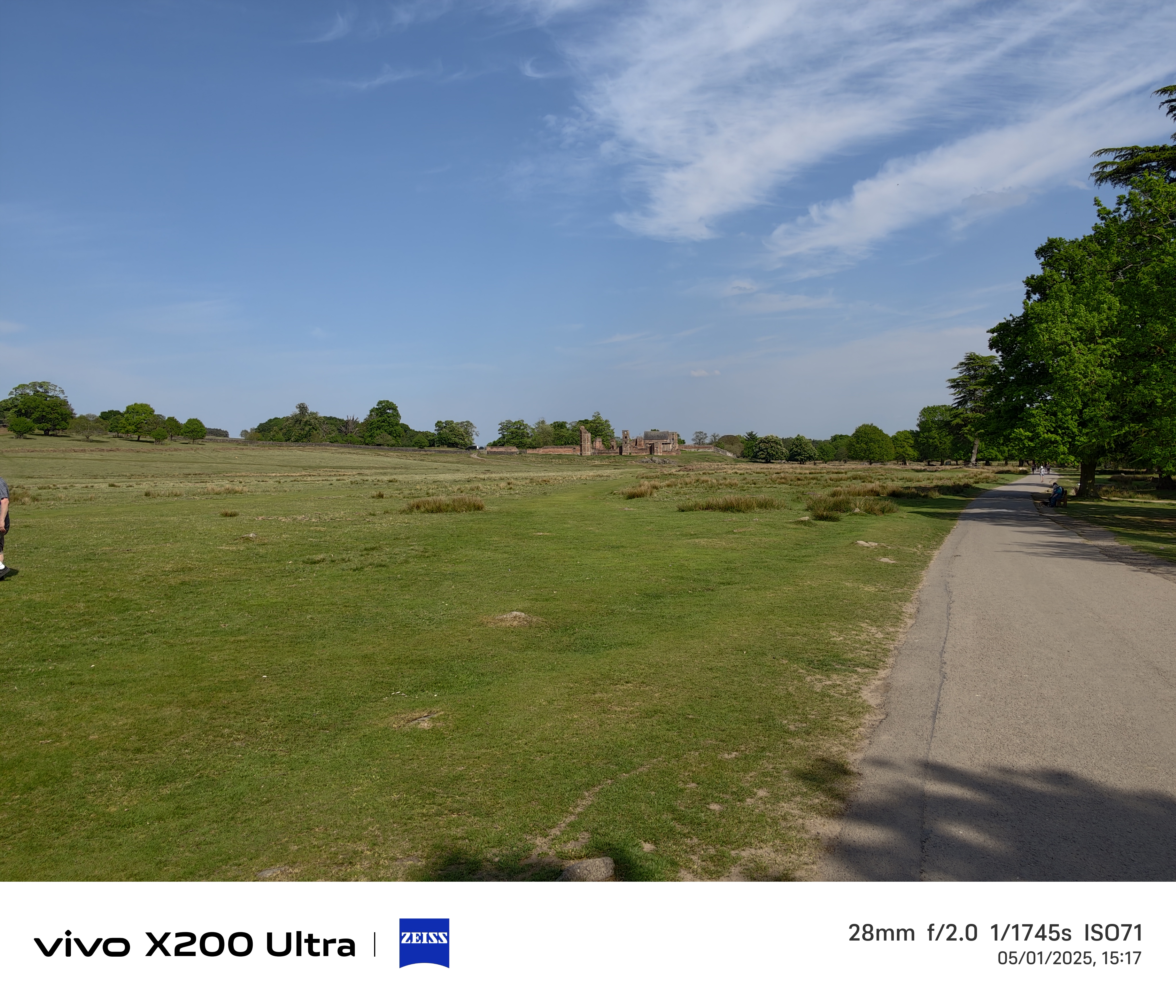 Old ruins in the distance across a field