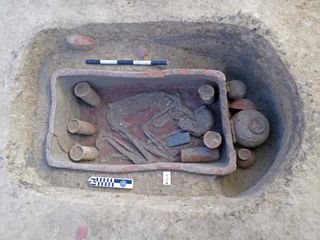 This individual had a number of grave goods. It appears that the red pigment ochre covered part of the grave when the deceased was laid to rest. 