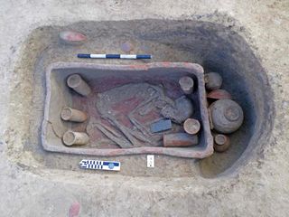 This individual had a number of grave goods. It appears            that the red pigment ochre covered part of the grave when the            deceased was laid to rest. 