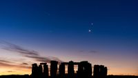stonehenge a series of rocks and a sunset sky with bright stars above