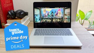 Prime Day October laptop deals 2024 badge over a Microsoft Surface Laptop Studio 2