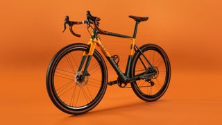 Colnago x Tod's T bike side-on shot on an orange background