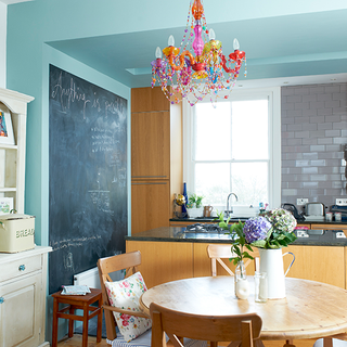 kitchen with blue wall and chandelier