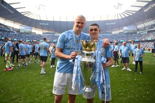 Erling Haaland and Phil Foden celebrate another Premier League title