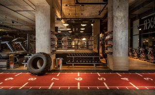The gym boasts a professionally sized boxing ring and vintage leather punch bags