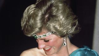 melbourne, australia october 31 diana, princess of wales, wearing a green satin evening dress designed by david and elizabeth emanuel and an emerald necklace as a headband, attends a gala dinner dance at the southern cross hotel on october 31, 1985 in melbourne, australiaphoto by anwar husseingetty images
