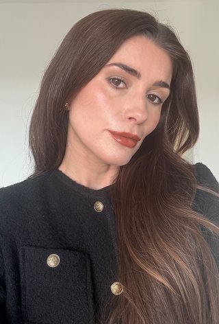 Eleanor wearing Hourglass glossy balm in shade Trace