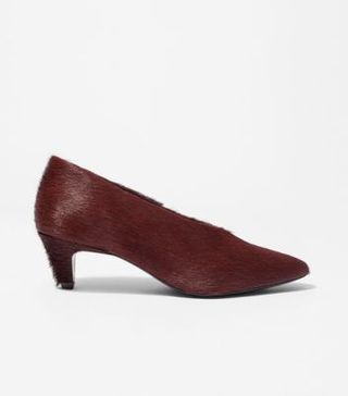 Image of red fur pumps