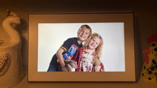 Pexar Starlight digital photo frame showing two children