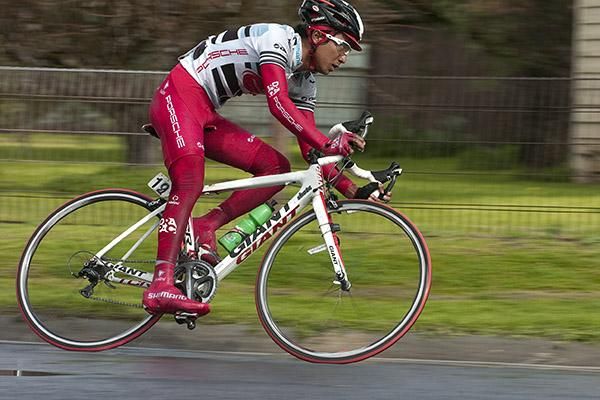 Malaysian road champion, Adiq Othman (Drapac Porsche), leans into a corner in Grovedale.