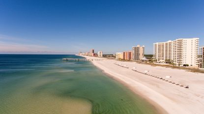 blue sea and beach with buildings