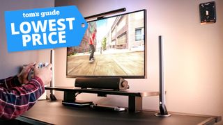 The Arzopa M3RC gaming monitor on a desk with a Tom's Guide Lowest Price deals badge