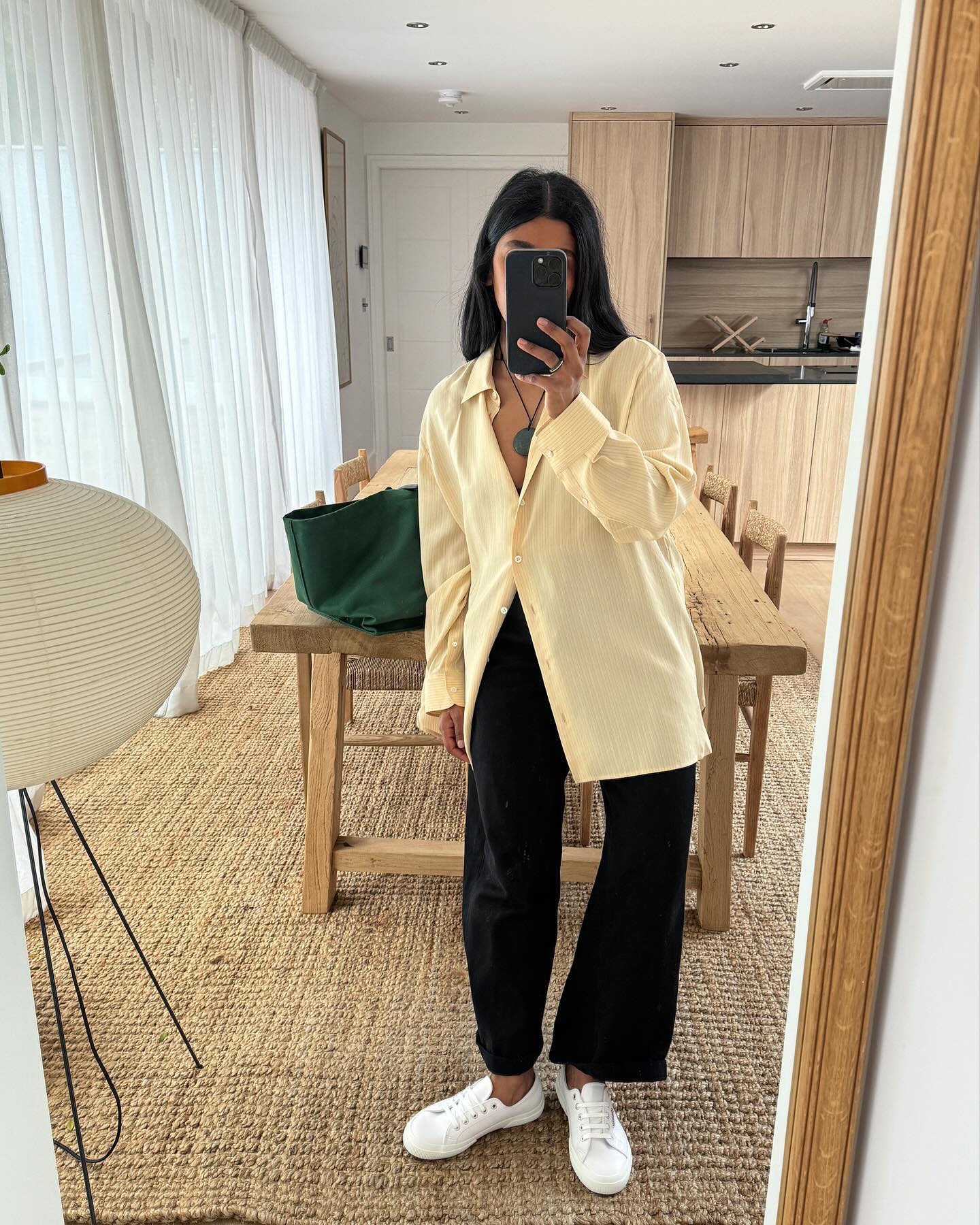 An image of @monikh wearing plimsoll shoes, one of the best summer trainers.