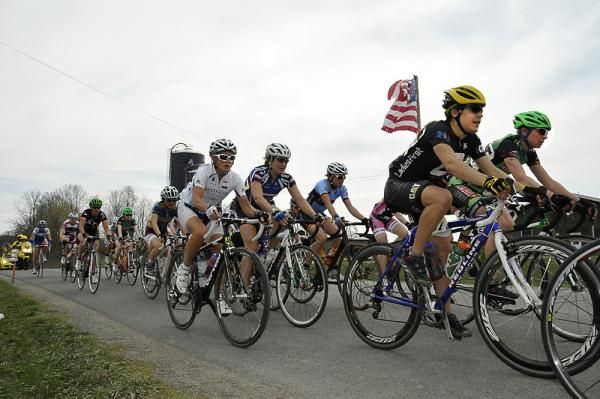 The American flag waves in the breeze as the race passes through a feed zone