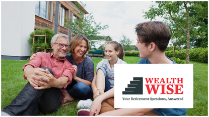 a couple in their forties relax with their two teenagers on the lawn in front of an expensive-looking modern home.