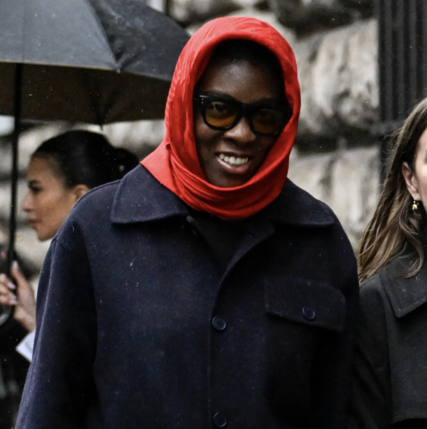 Nikki Ogunnaike wearing a coat and a red scarf