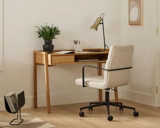 Small wooden desk with white desk chair