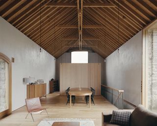 main living space with exposed roof structure at Redhill Barn in the UK