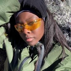 A woman with smooth, hairless, glowing skin.