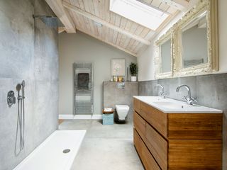 bathroom in neutral colors with wooden vanity unit and concrete tiles and shower backsplash