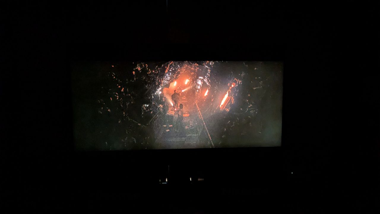 Hisense 116-inch UX RGB mini-LED TV displaying Alien Romulus in dark room