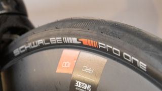 A black Schwalbe Pro One TLE tyre mounted to a DT Swiss rim