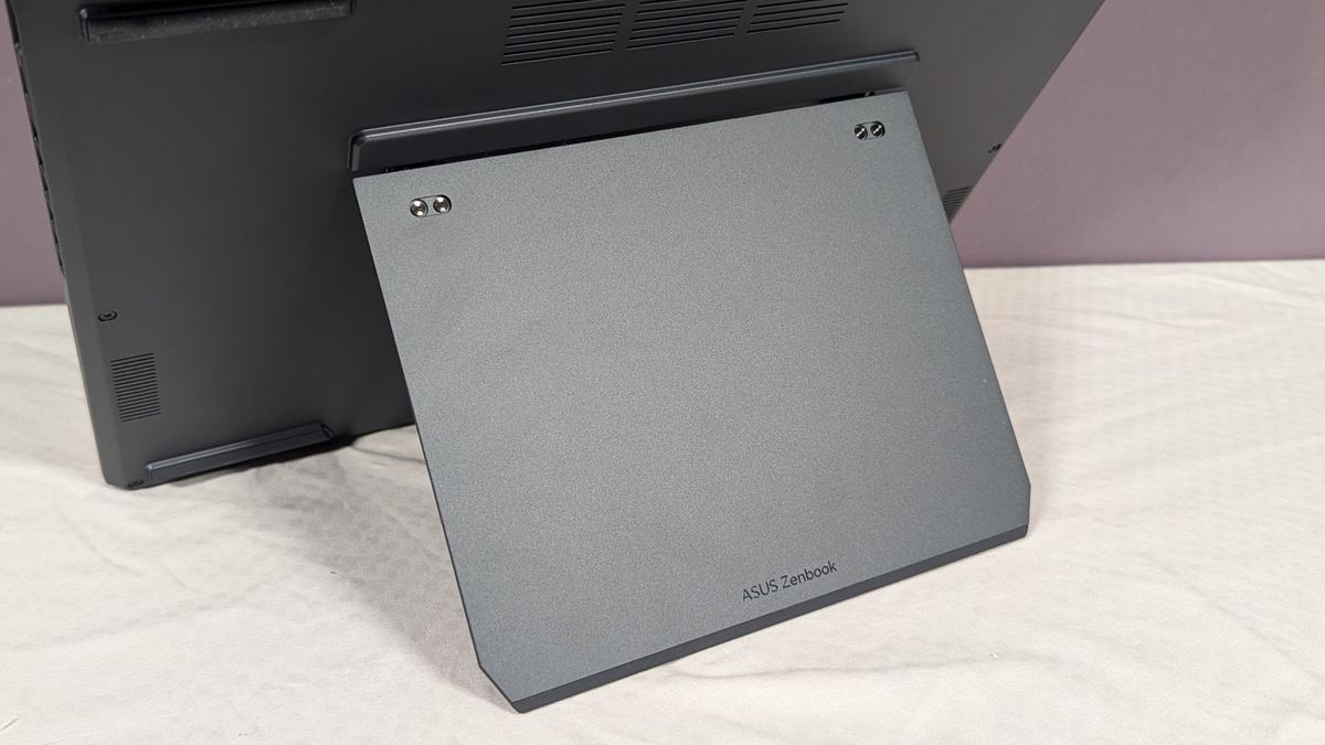 A close up of a wide kickstand attached to the back of a laptop.