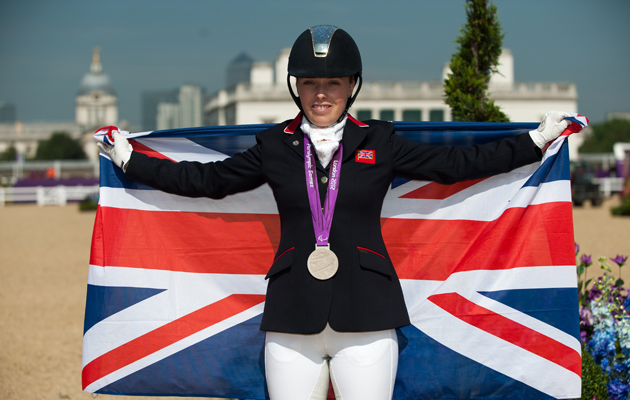 Sophie Wells (GBR) poses with a union flag to celebrate her silver medal in the Grade IV Individual Freestyle - Dressage - London 2012 Paralympic Games - Greenwich Park, London, United Kingdom - 4 September 2012