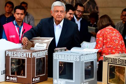 Mexico's presidential candidate Andres Manuel Lopez Obrador for the 'Juntos haremos historia' party, casts his vote during general elections, in Mexico City, on July 1, 2018.