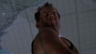 John McClane yells over a broken window in Die Hard