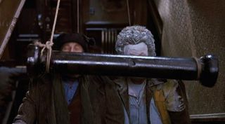 The metal bar hitting both Marv and Harry on the stairs in Home Alone 2.