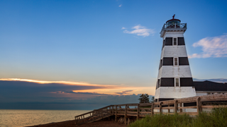 The black-and-white striped West Point Lighthouse