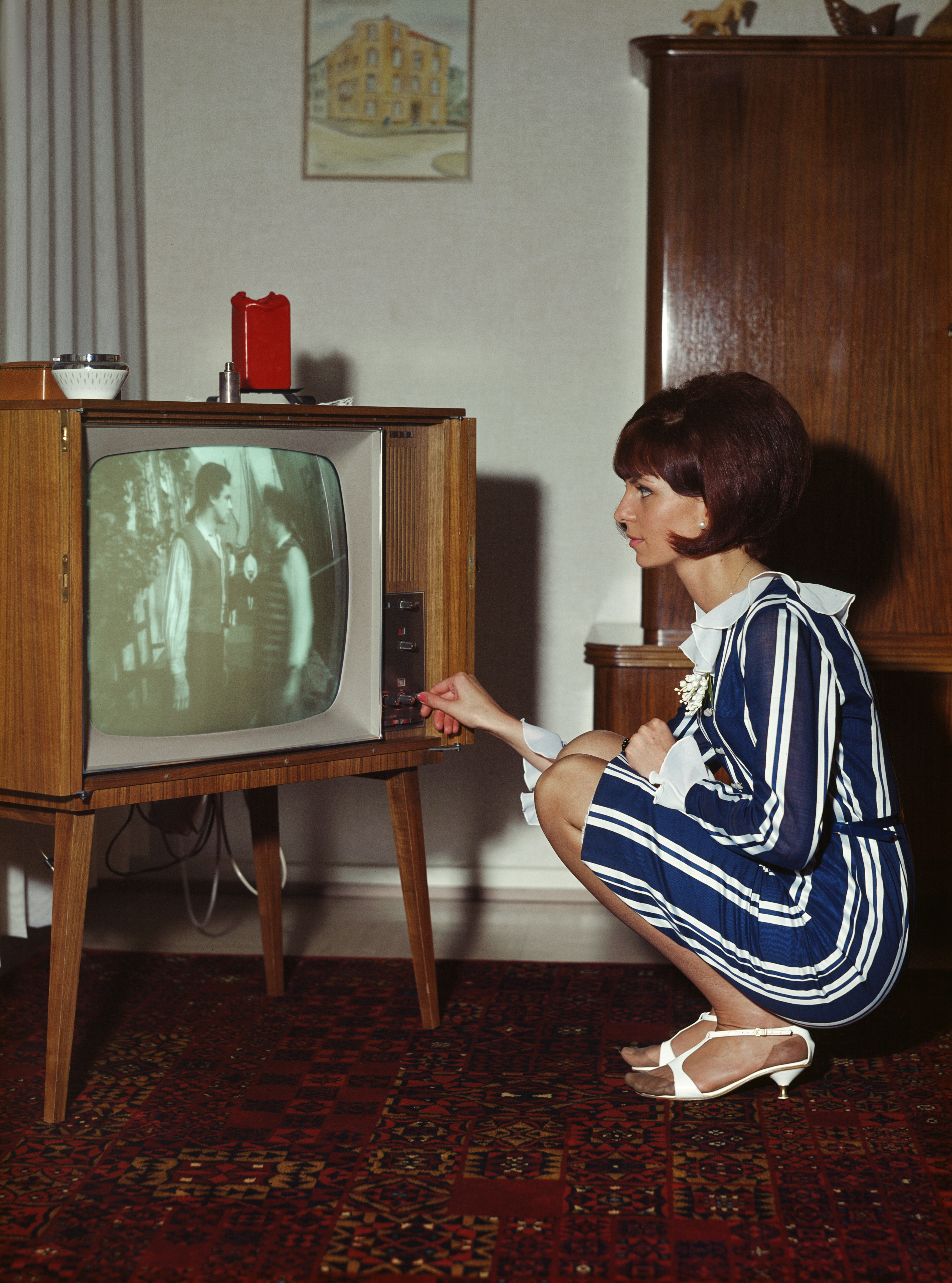 Vintage photograph of woman watching television