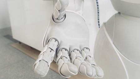 white robot hand extending to you 